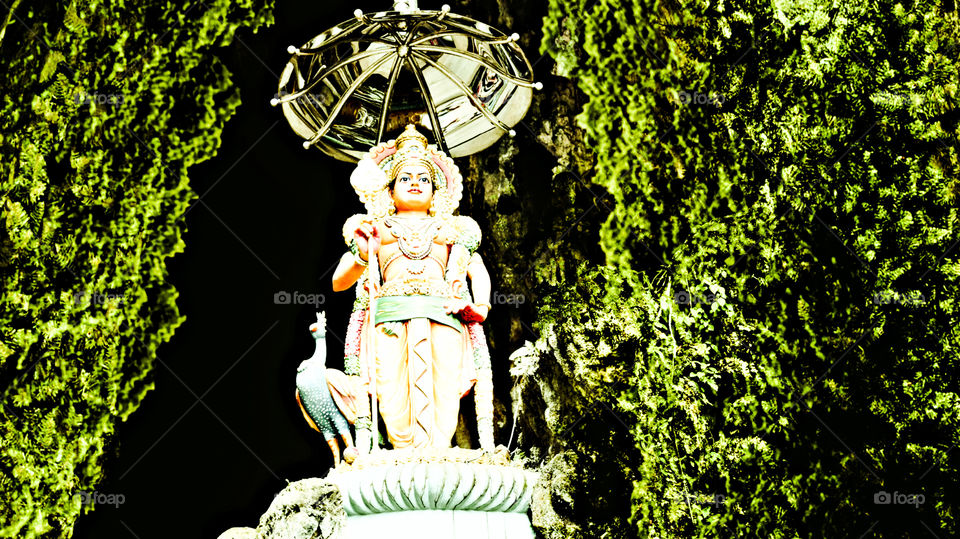 god kartikeya sculpture in caves photography