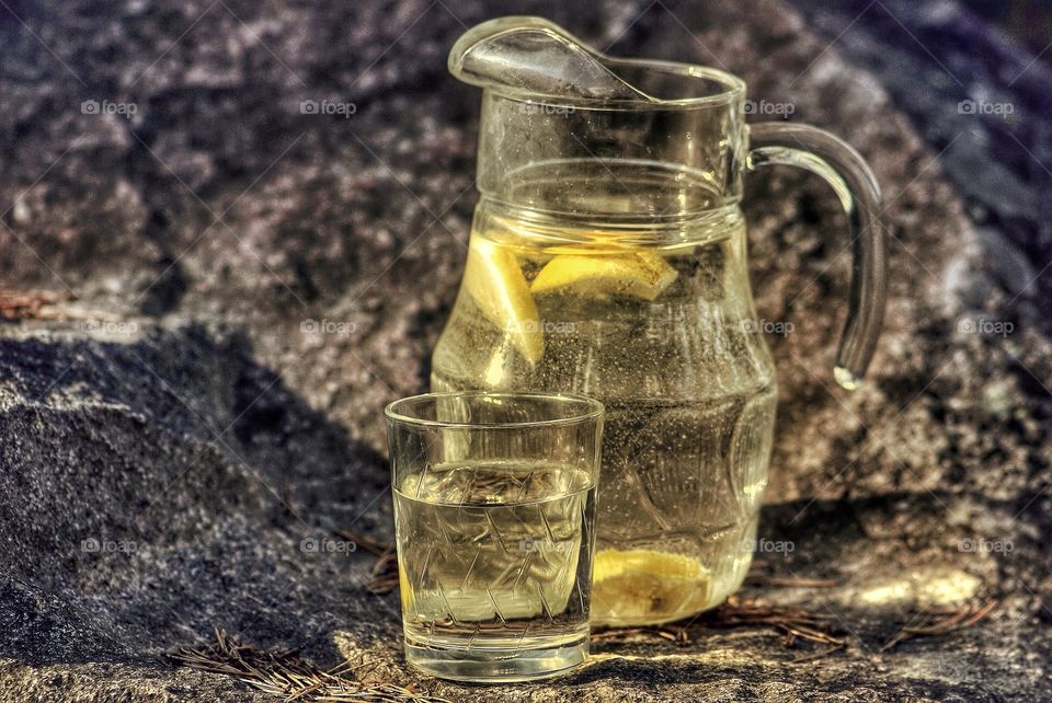 Lemon juice in jar and glass