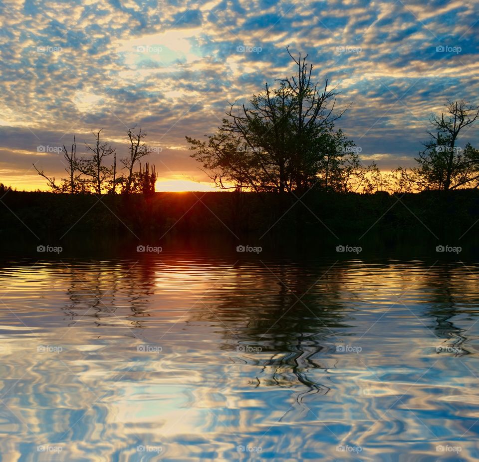 Dramatic clouds reflecting on the lake