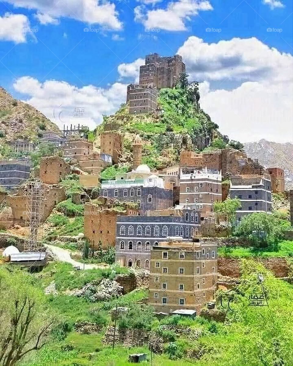 A stunning view of green mountains covered in fog in Yemen