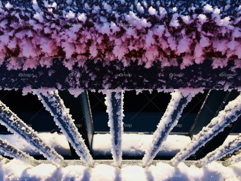 A metallic bridge covered in frost / closeup