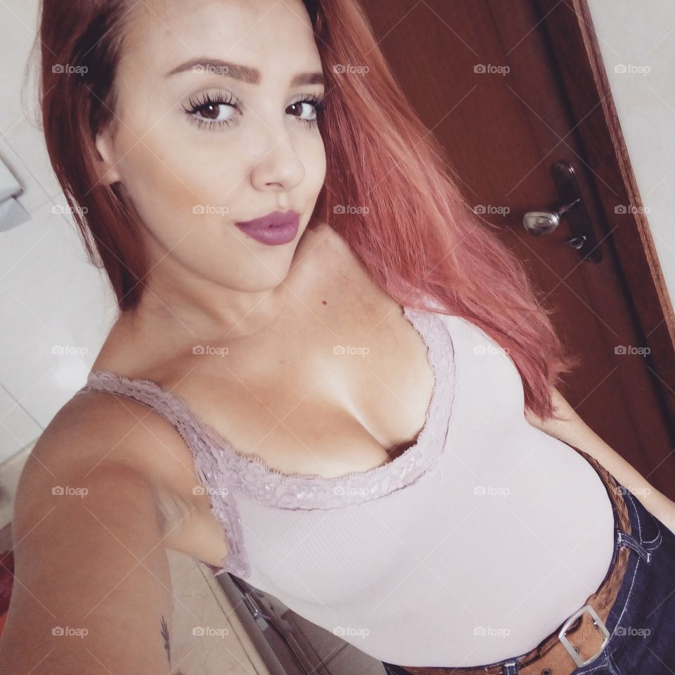 Portrait of young woman taking selfie