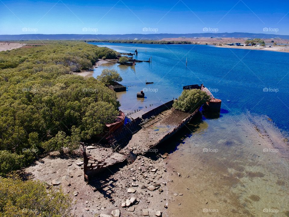 Aerial photo of the rusting shipwreck of the MV Sunbeam at Garden Island Ships graveyard