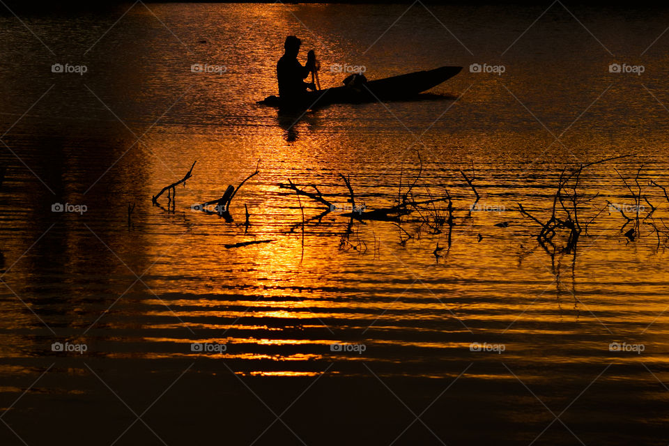 Fishing boat photo with sunset
