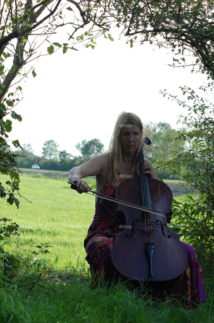 Cellist in the landscape