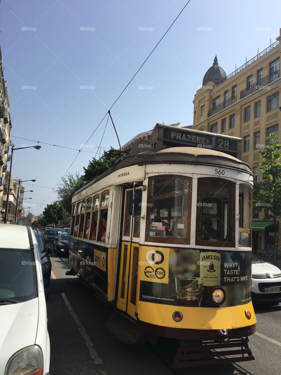 Classic right rolling good old yellow tram in Lisbon