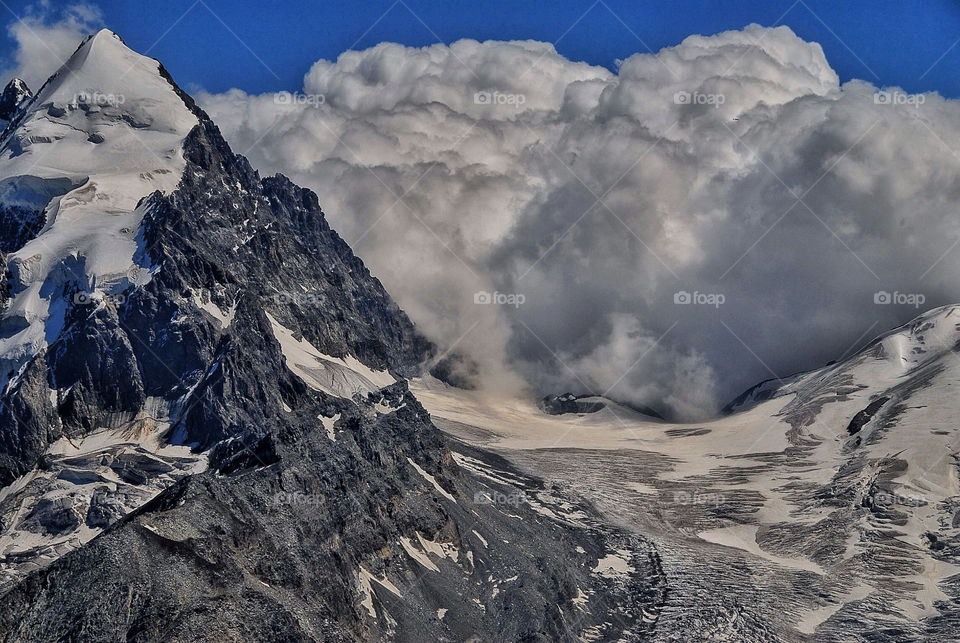 clouds storm mountains glacier by lguarini