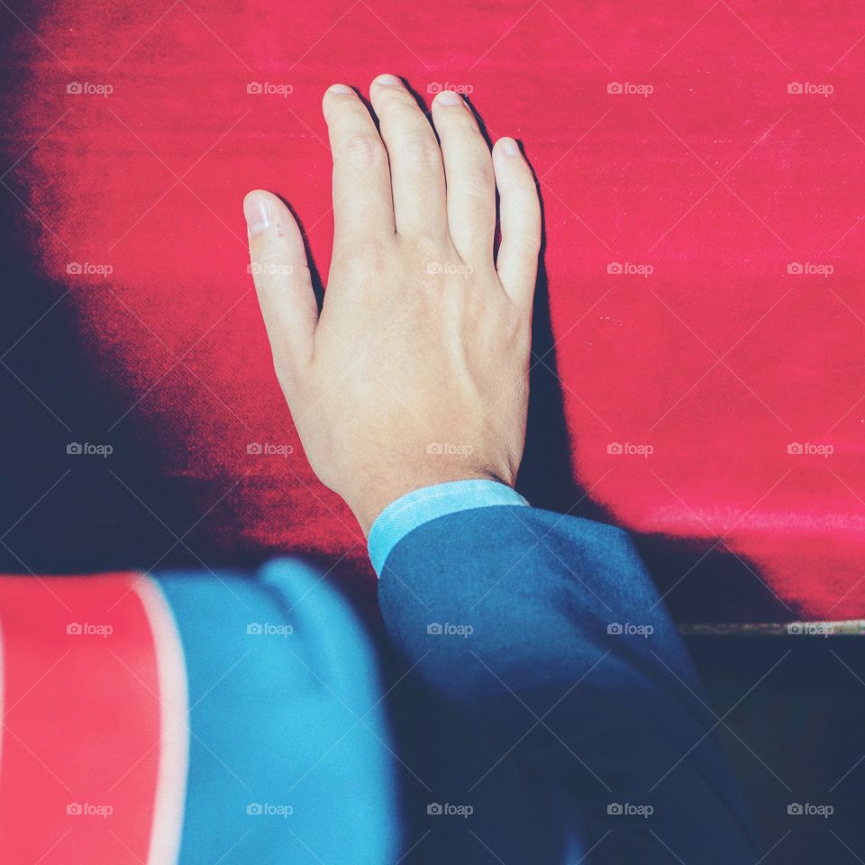 A hand close up in an official ceremony