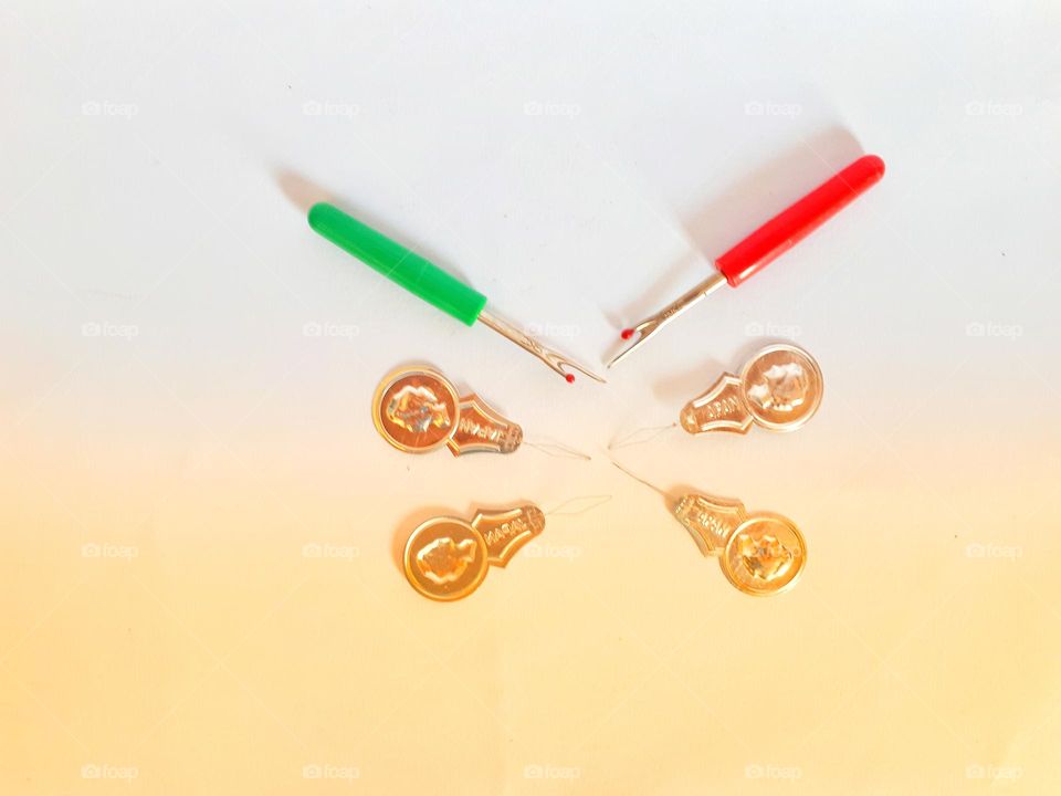 sewing kit such as seam ripper and Needle threader