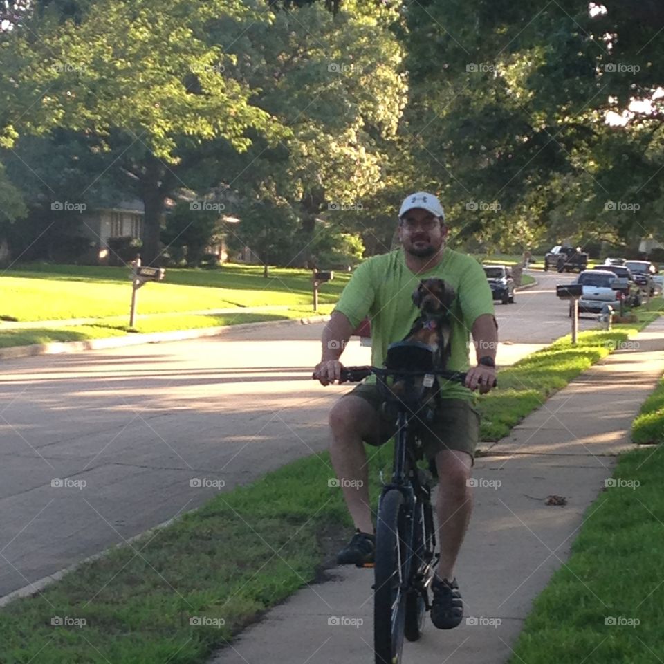 Riding a bike with your dog. 