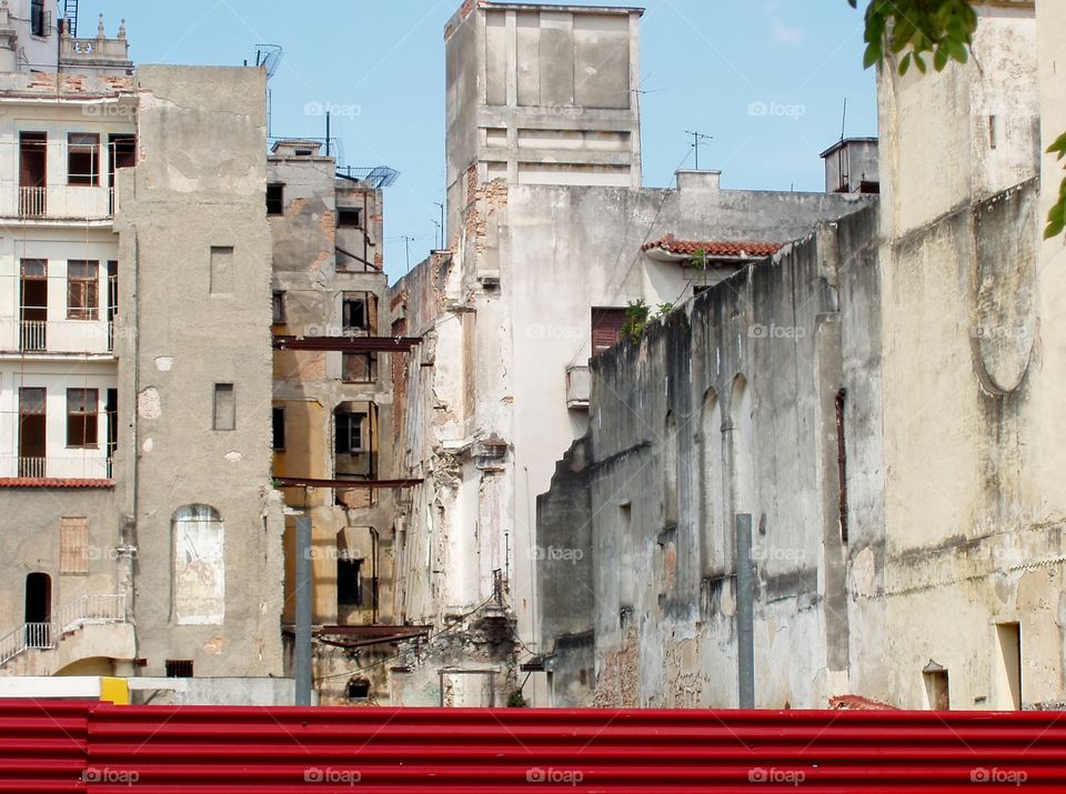red wall and destroyed buildings