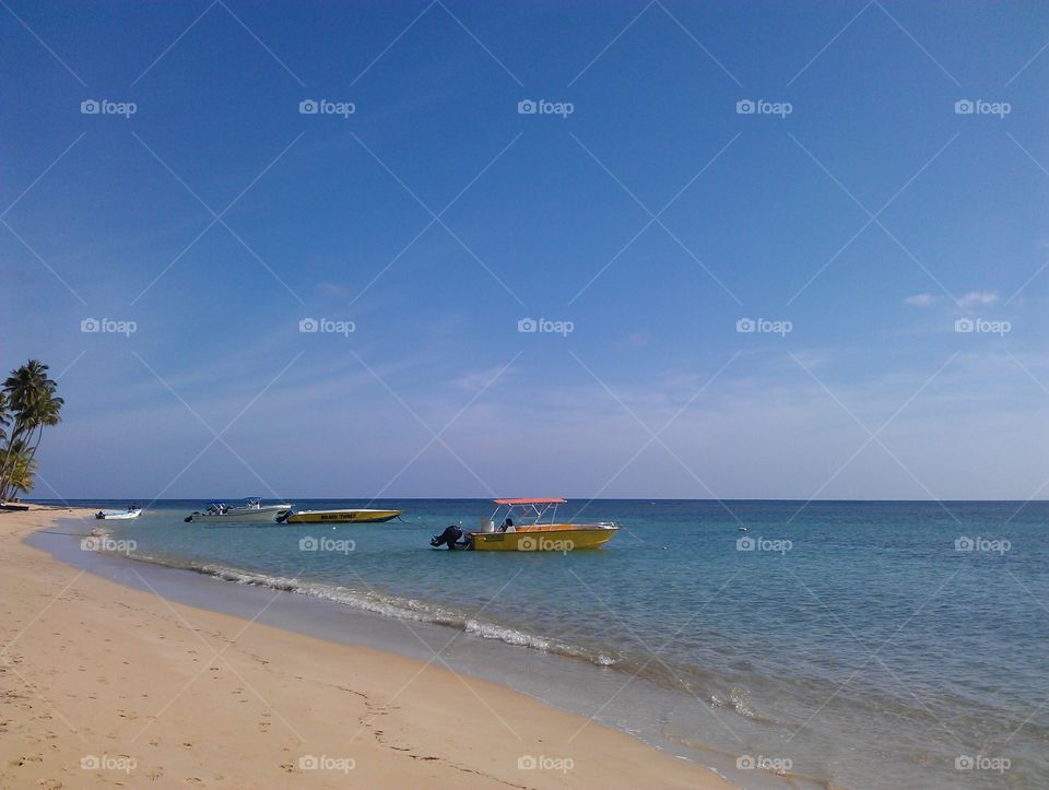 boats on caribbian beach. nosta, sea and blue sky on caribbian coast