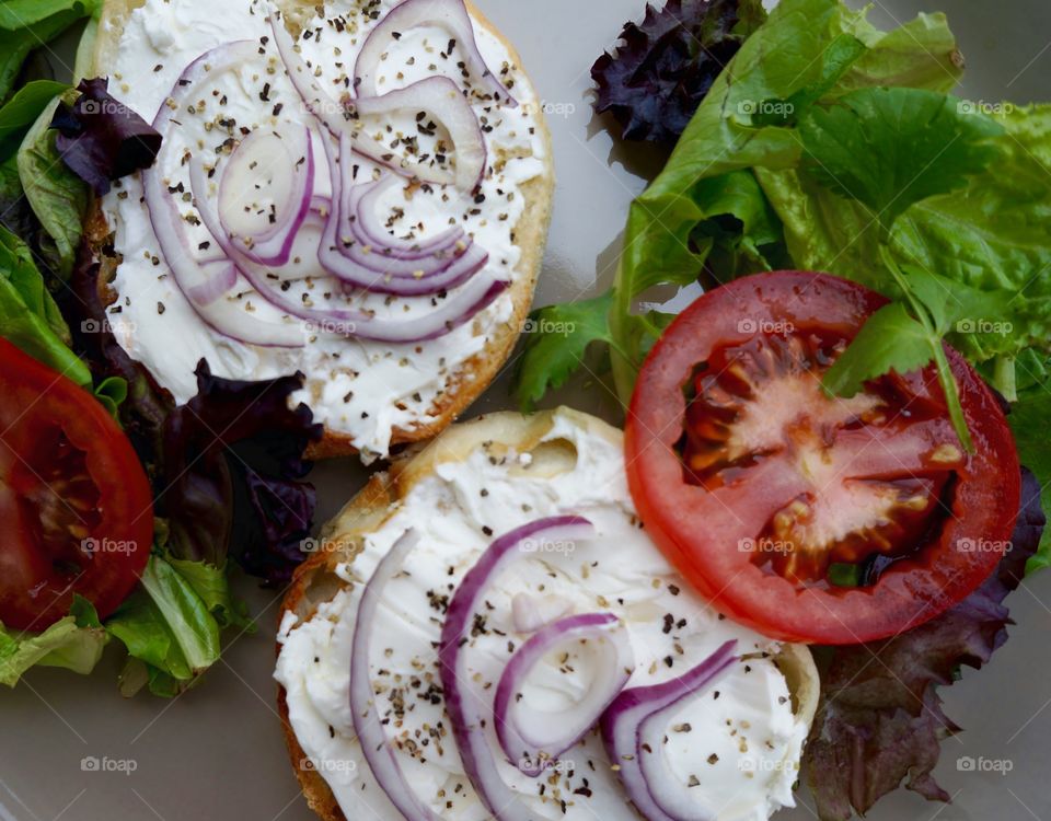 English Muffin Sandwich. Topped with Cream Cheese, Tomato & Lettuce