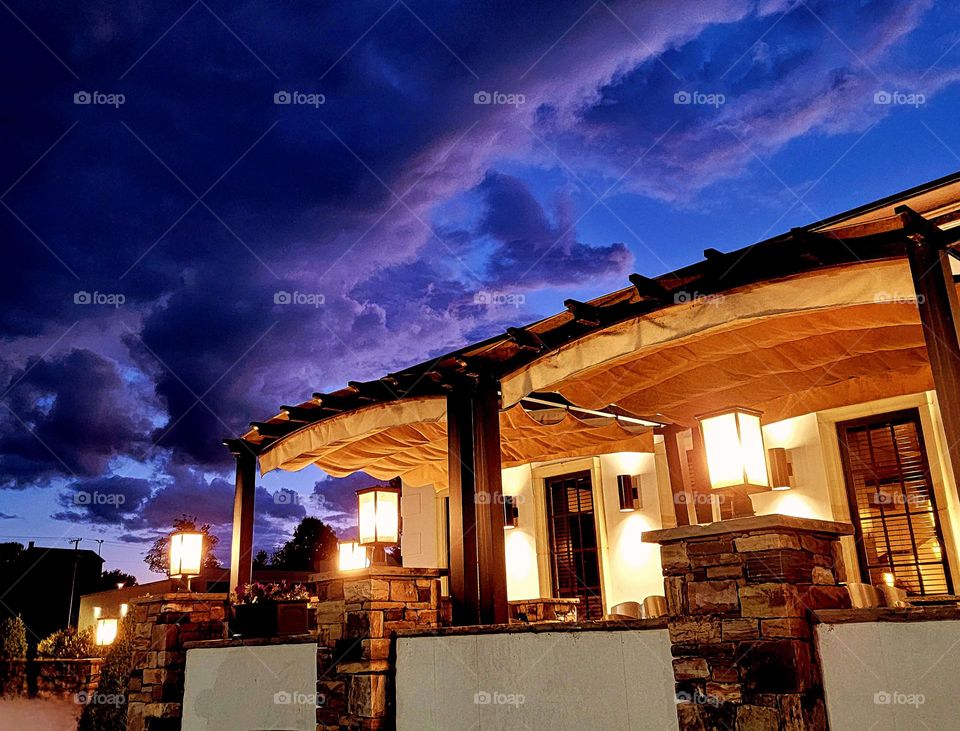 Night sky approaching warmly lit hacienda