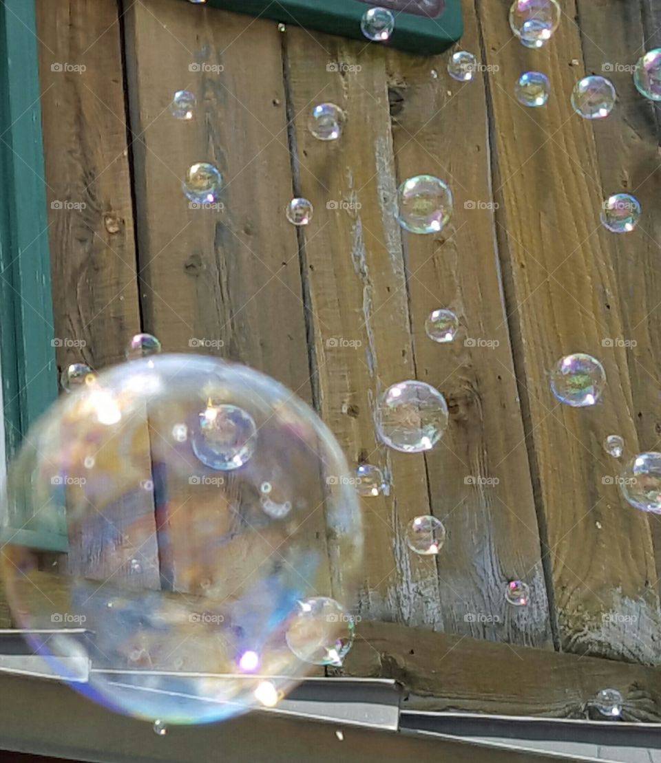 tiny bubbles. Saw a bubble machine making all the bubbles