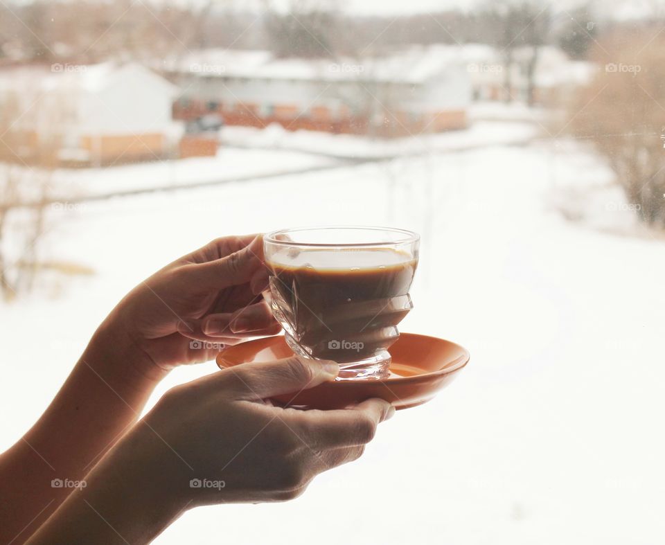 my hot chocolate and the view of outside  covered with snow