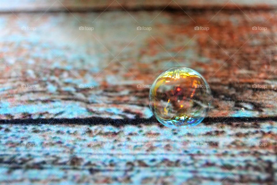 Single bubble falling on ground