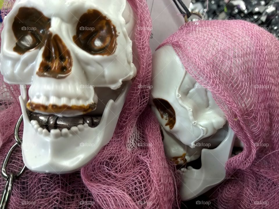 Skull decorations wearing mesh cloth for Halloween.