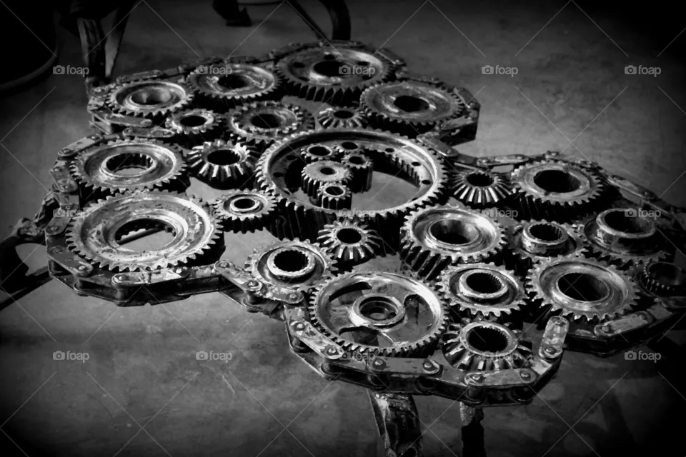 This is a black and white photo of table made with gears for the Children’s Museum in Indianapolis, Indiana.