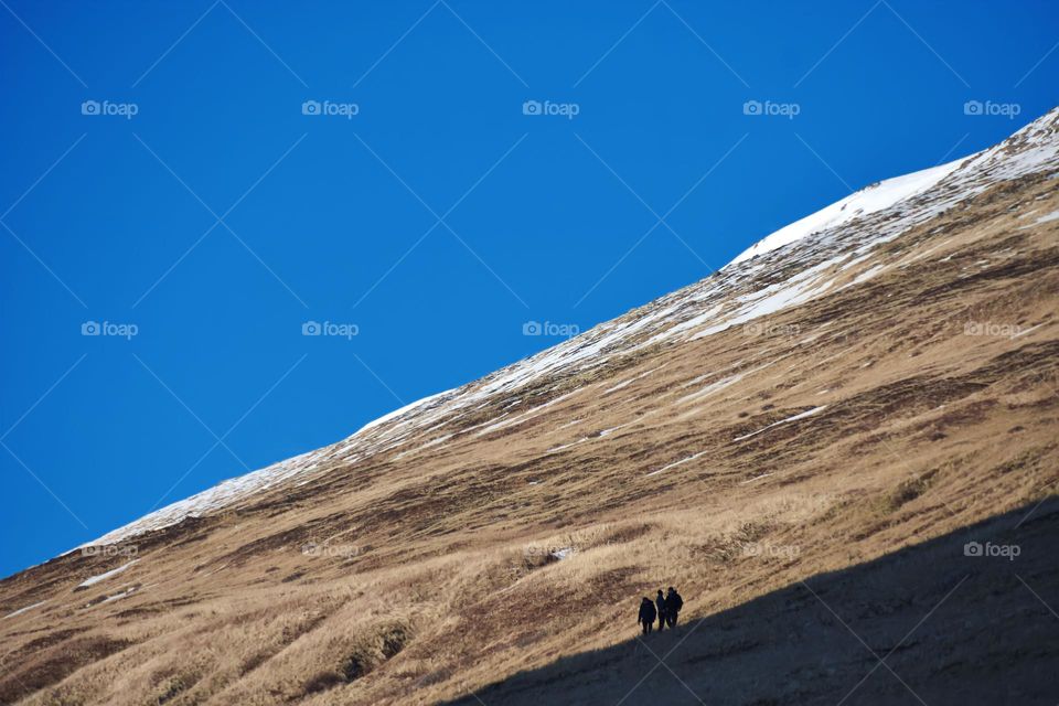 hiking and chasing sun light on vulcanic mountain