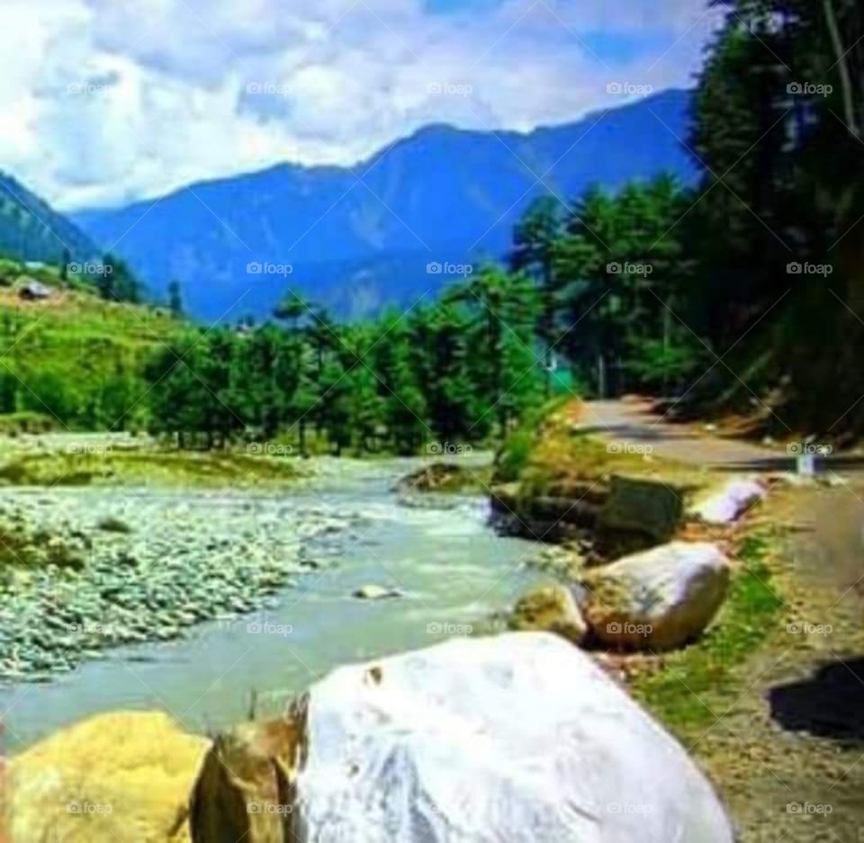 serene ... brook, pebbles, stones, rocks .. mountains. Otw to Palhagam, Kashmir