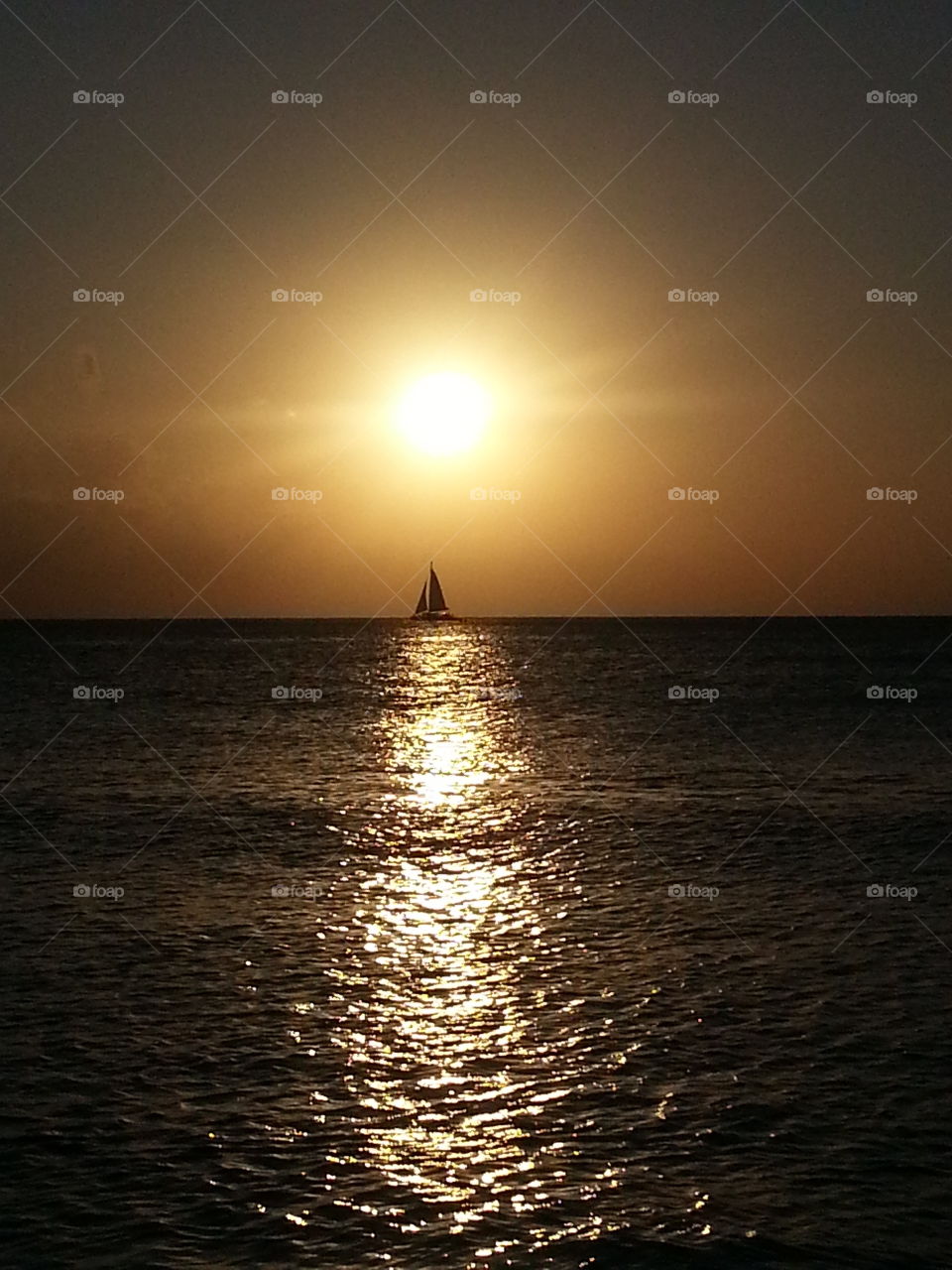 Sailing through Cayman Islands. Watching the Sunset while on vacation and captured this Beautiful Picture!