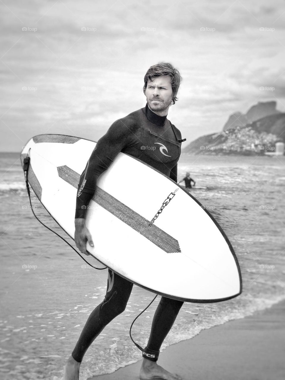 coming back from the ocean surfing