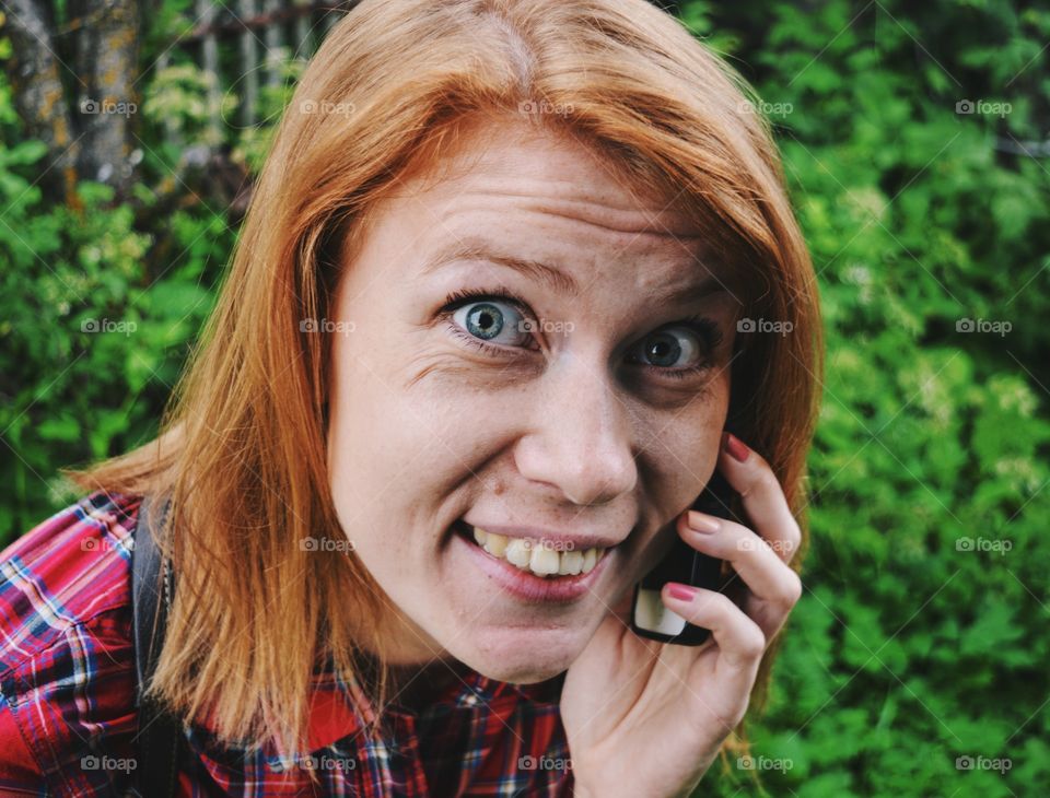 Girl calling with telephone 