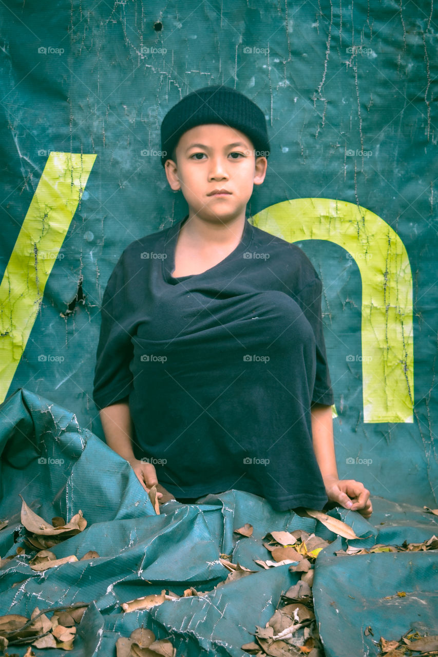 Portrait of a boy with an artist mood