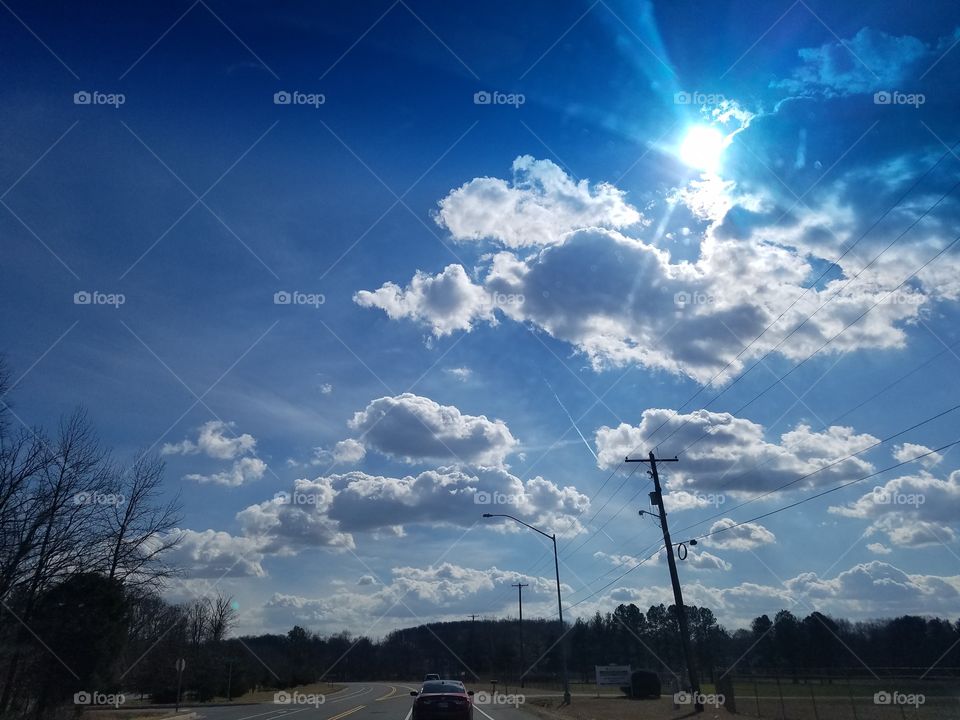 the sun peaking from the clouds in Maryland