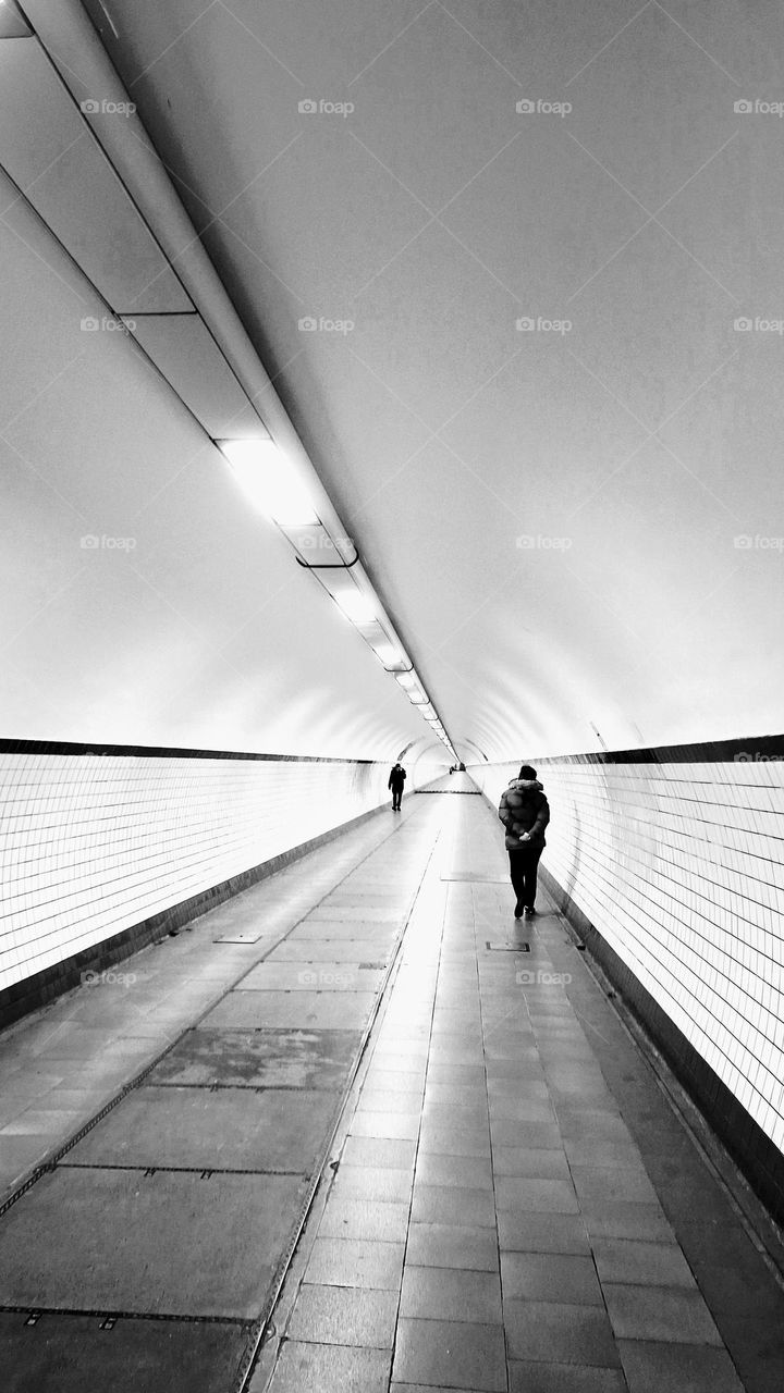 The nearly 600 meters long St-Anna pedestrian tunnel connects the centre of Antwerp with the Left Bank district since 1933.  The beautiful wooden mechanical stairs and entrance buildings are very well preserved, a rare Art Deco gem.