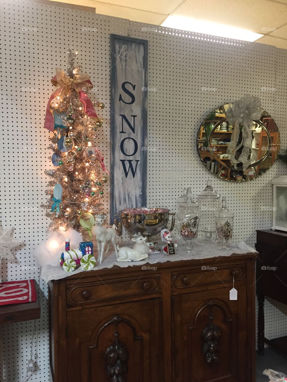 A pretty winter scene decorating a vendor stall in an old antique store. 