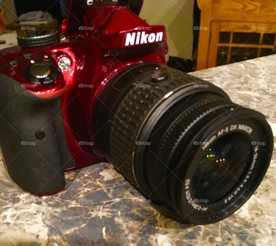 Nikon camera 🎥 red. Close up view. Model is D3300