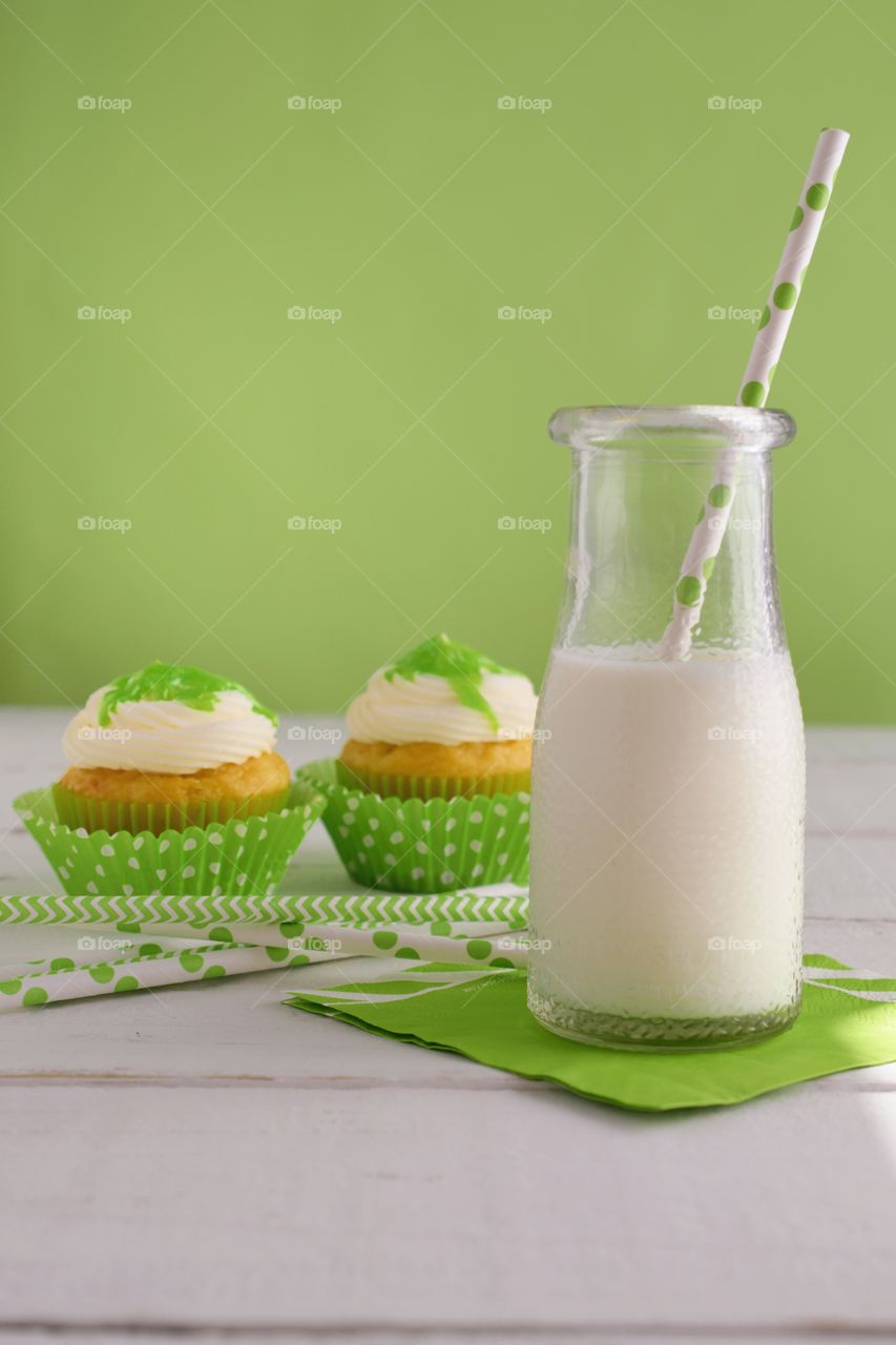 Cupcake with juice in bottle