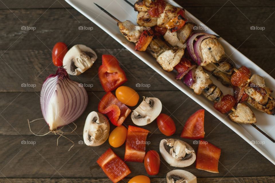 Close-up of kababs and ingredients
