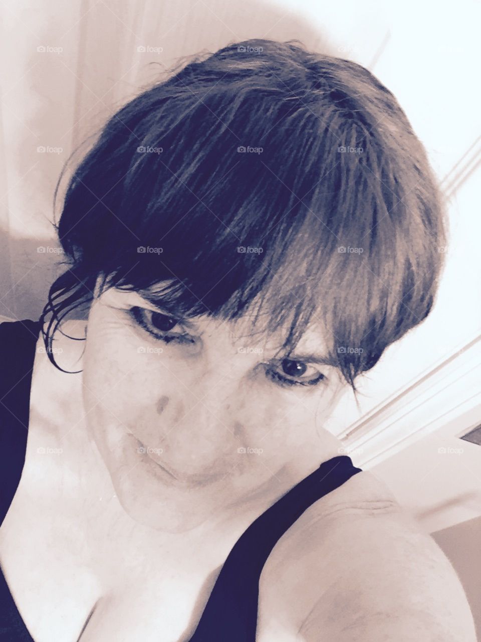 Closeup of older woman smiling.