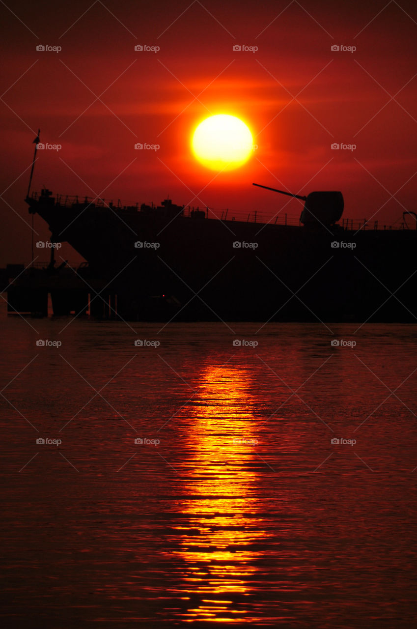 Scenic view of boat in sea during sunset