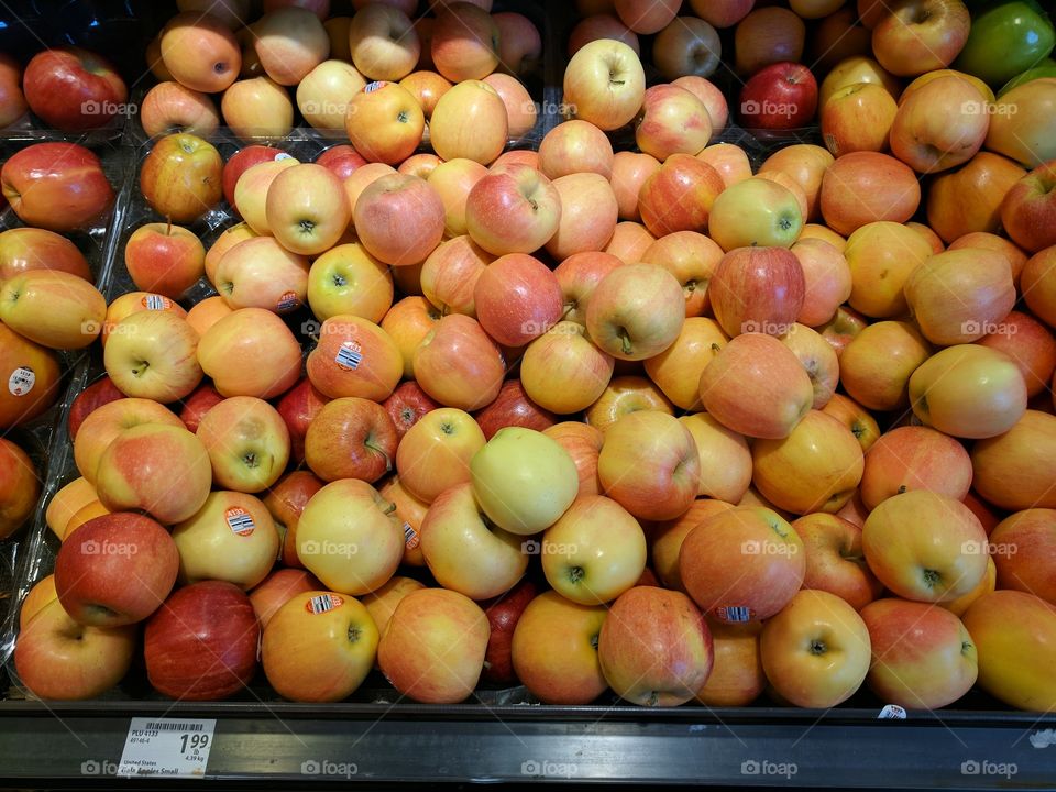 Shelf full of Gala apples