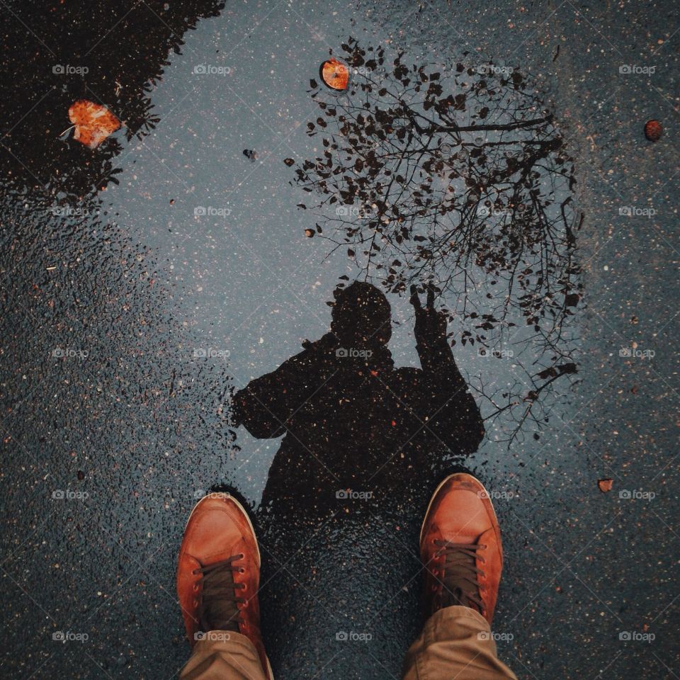 Reflection of a man on the street