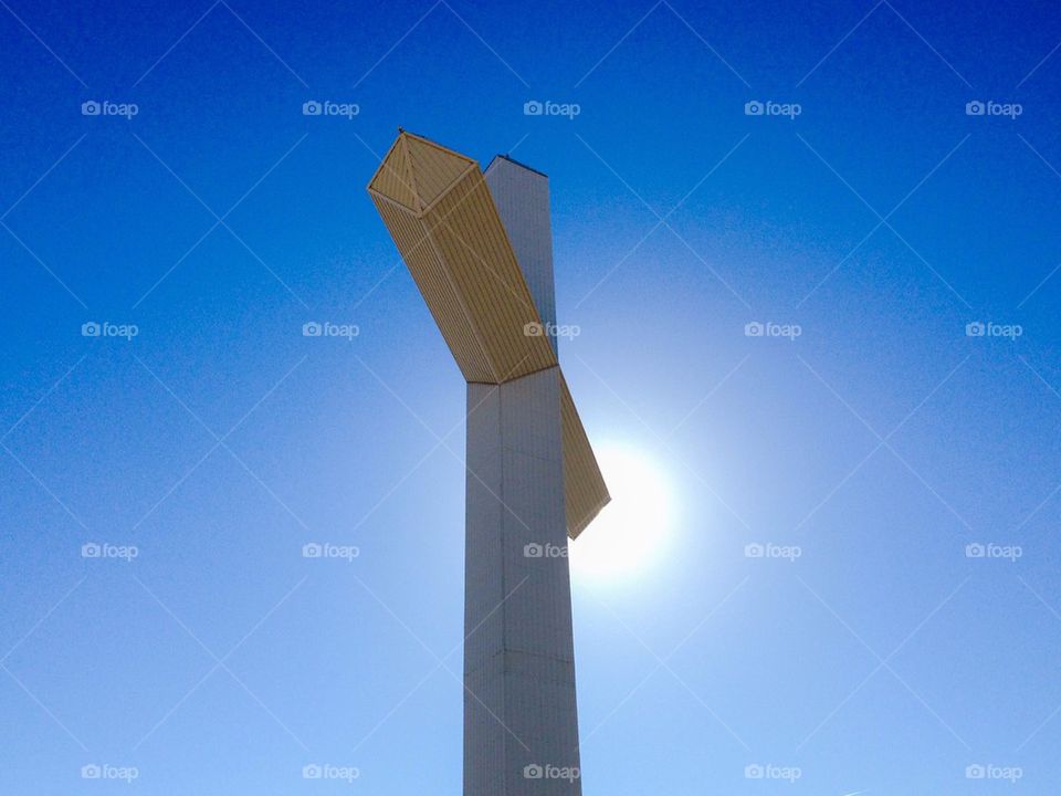 God shines. Sun behind cross