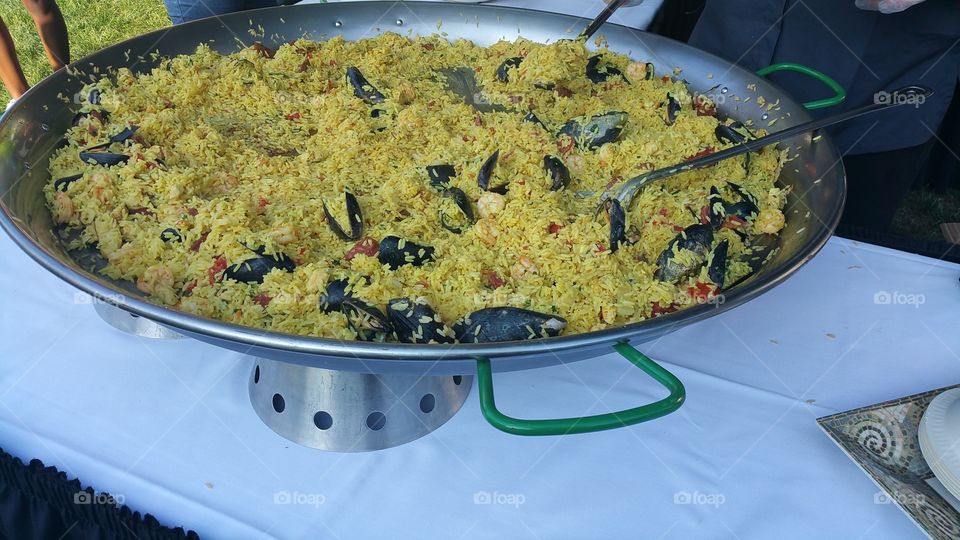 massive paella with shrimp, chicken, mussles and chorizo.