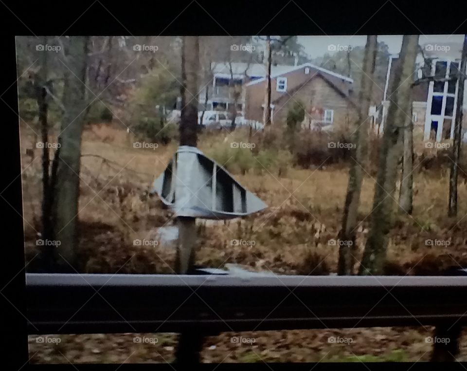 Boat bent across tree in Medford Lakes NJ from flood mid 2000's