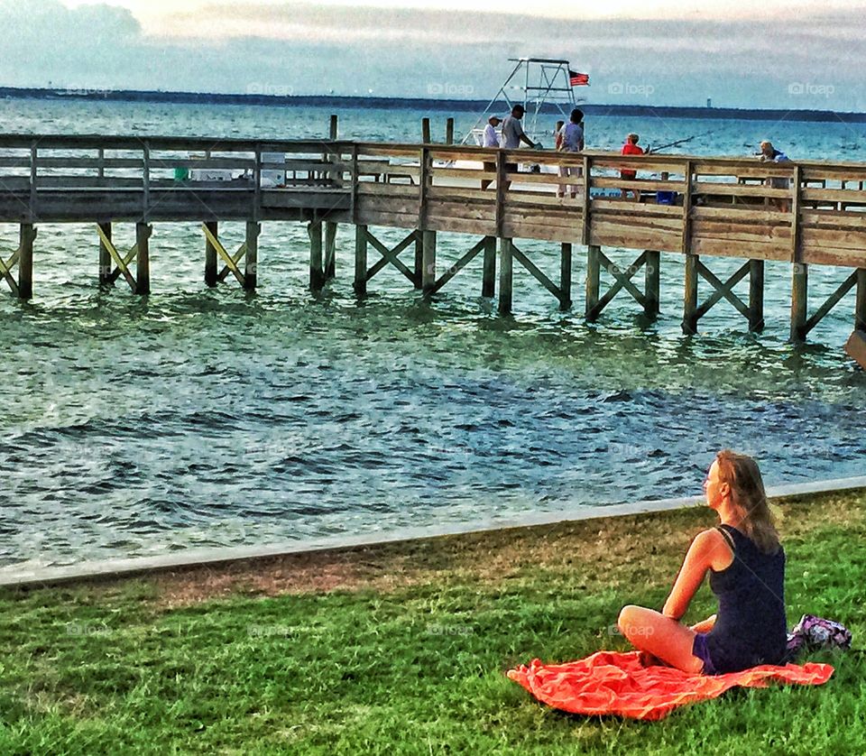 Solitude. A young woman enjoying the golden hour