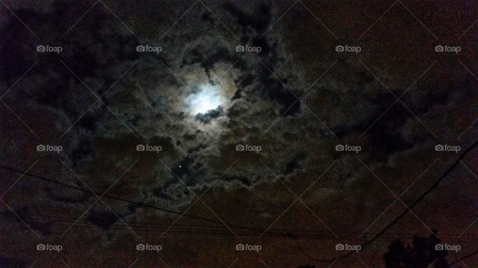 Full Moon and a lone star amid the night sky clouds!