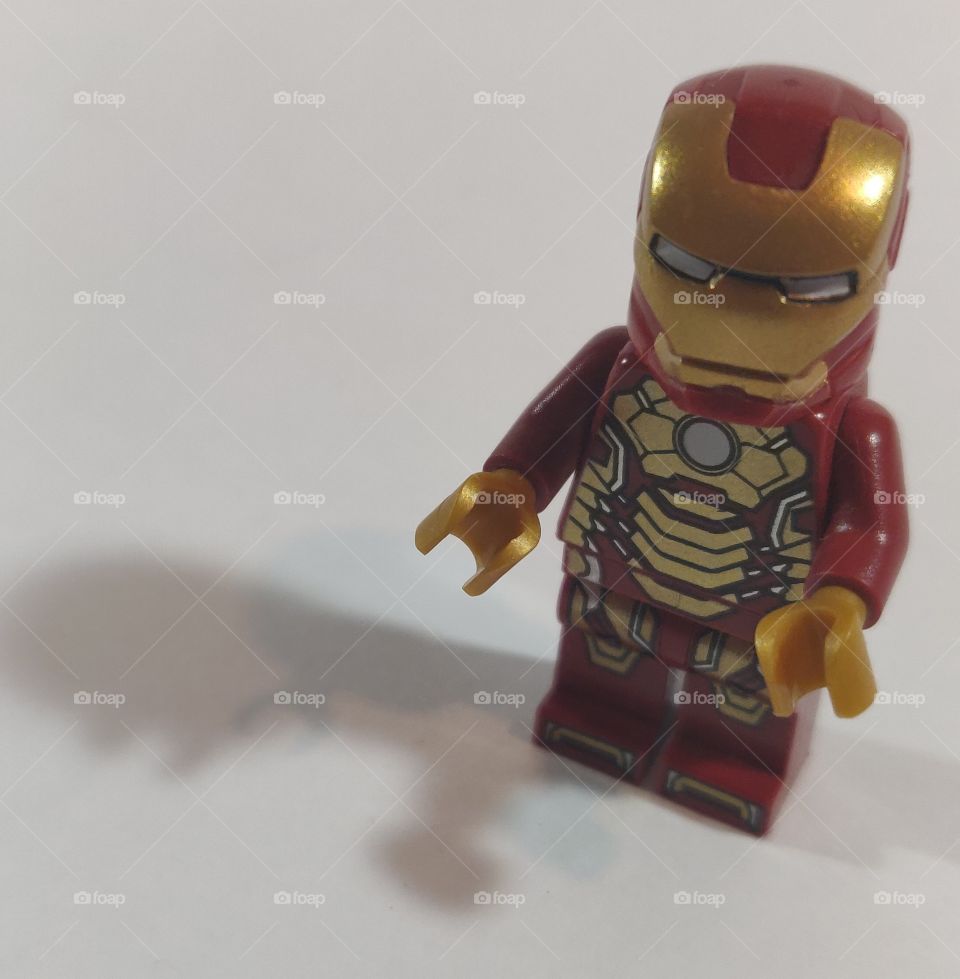 Lego Iron Man and his shadow.