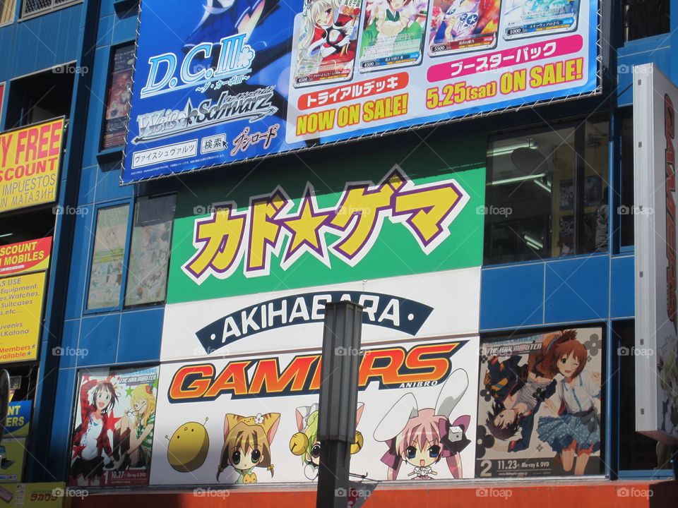Akihabara, Tokyo, Japan.  Colorful Card Games Billboard Written in Katakana