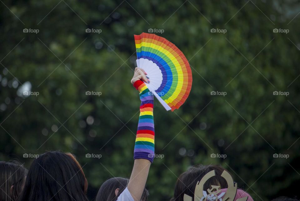 Rainbow fan in a hand