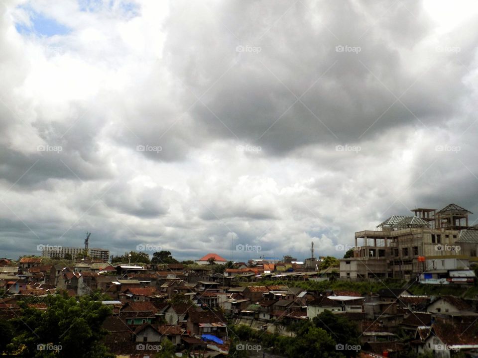 Cloudy over urban houses