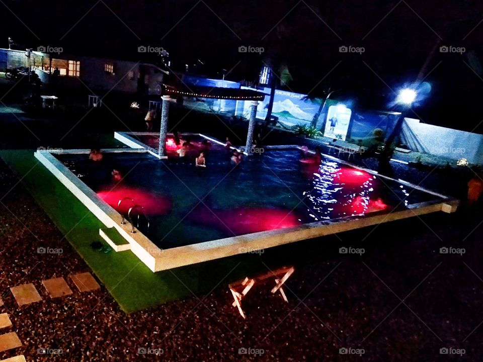 Swimming pool with magenta fantastic  lightings
