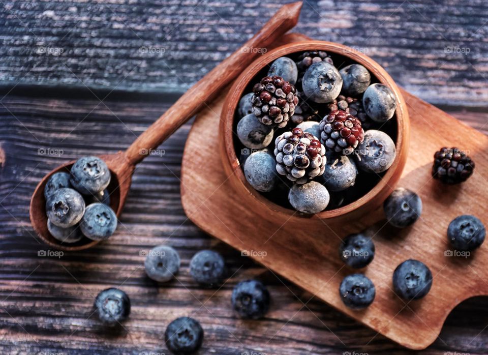 berries on a wooden bowl